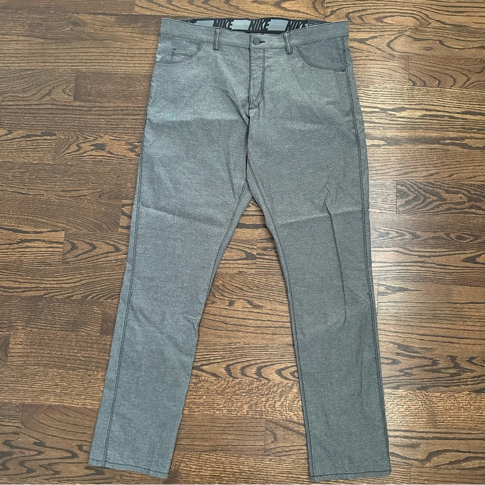 Nike golf slim fit pants. New with tags. Gray.